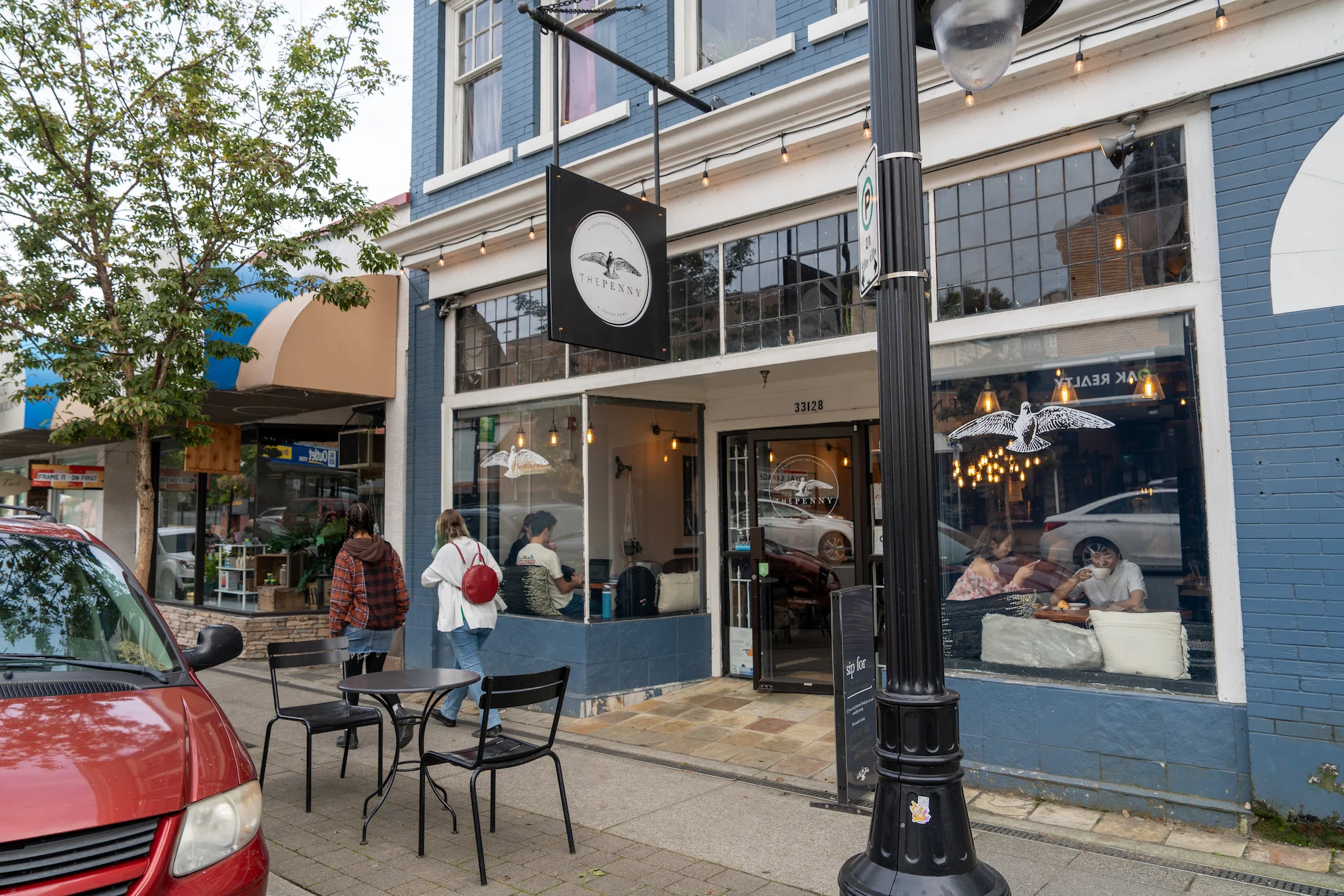 Street view of local dining and boutique shops in Mission, BC, highlighting restaurants and cafés located near Madison townhomes.