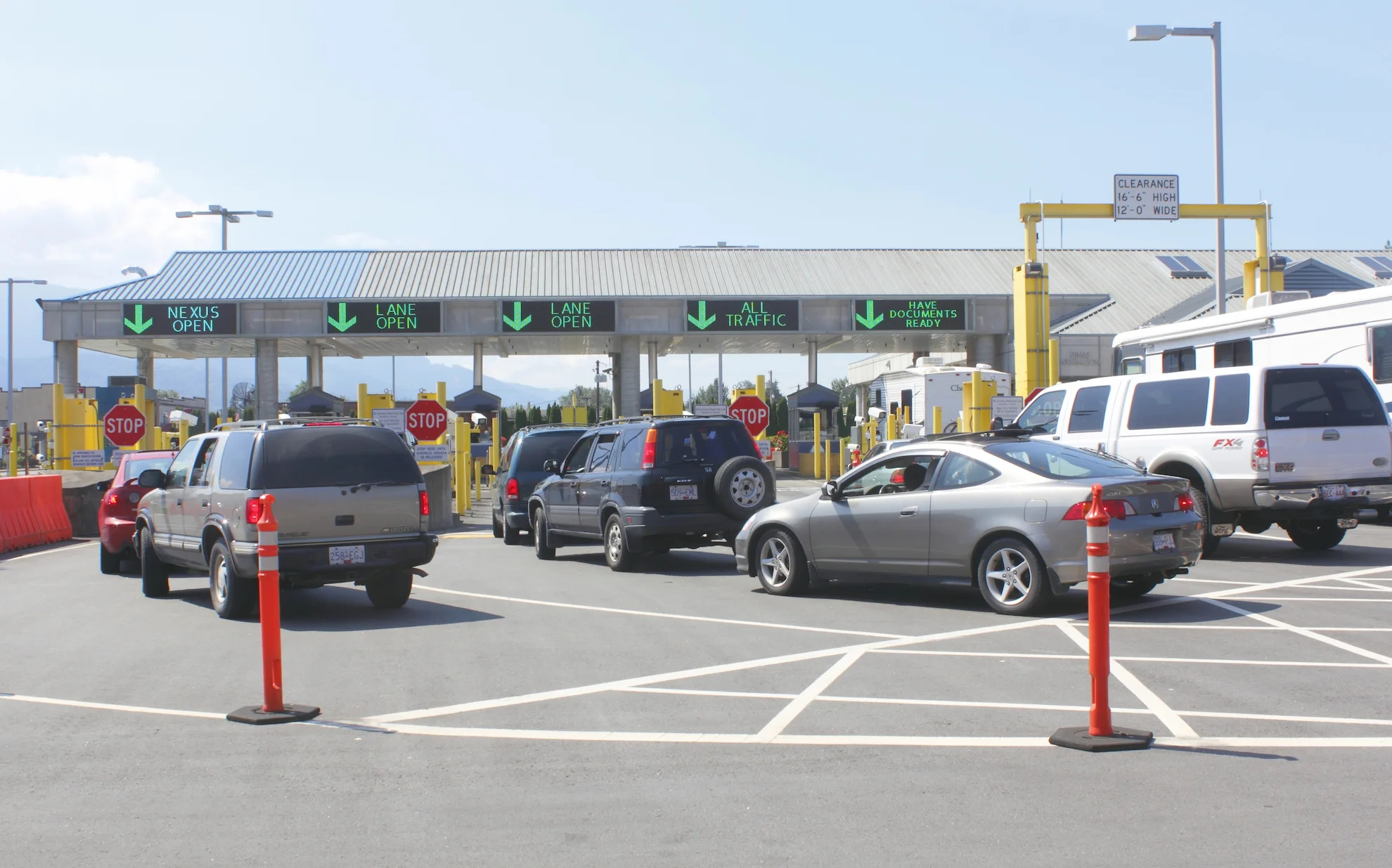 Cars lined up at the Sumas border crossing, highlighting convenient regional access from Madison townhomes in Mission, BC to the US and Vancouver.