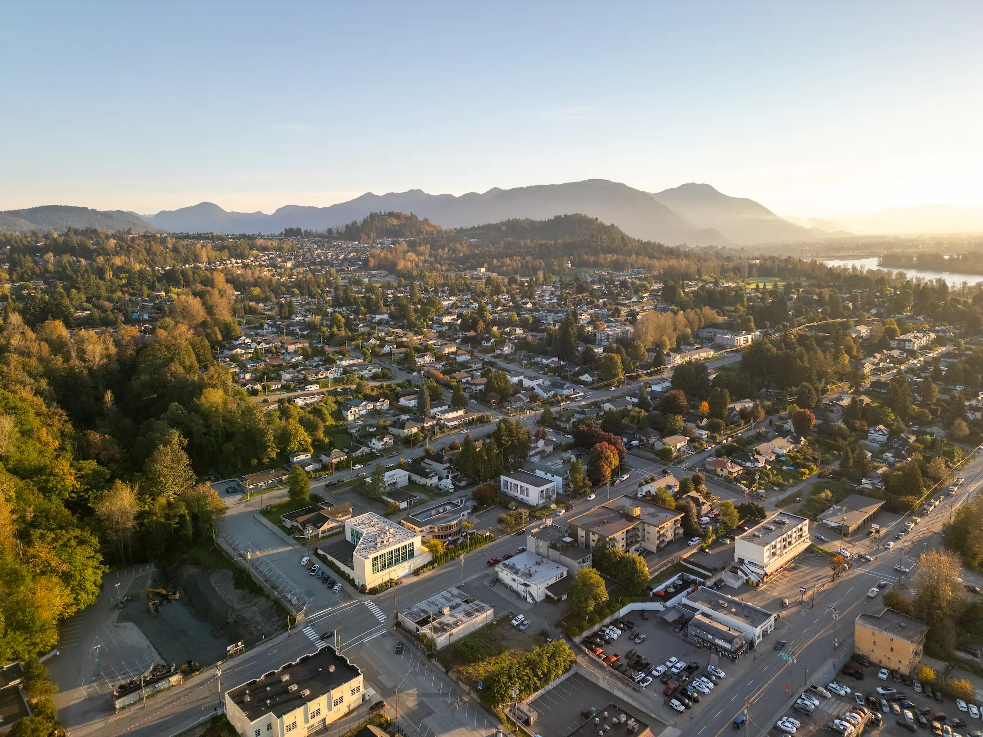 Aerial view of Mission, BC at sunset, highlighting the suburban neighbourhood setting near Madison townhomes on Cherry Avenue.